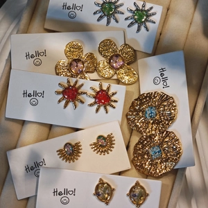 Handmade dried flower earring set in vintage gold finish with various floral resin designs