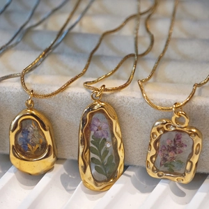 Handmade necklace with real dried flower pendants in gold stainless steel frames
