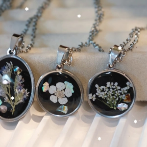 Handmade Black Forest necklaces with real dried flowers in silver stainless steel frames