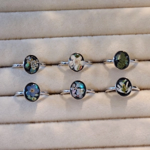 Handmade silver open rings set with black resin and preserved dried flowers in jewelry box