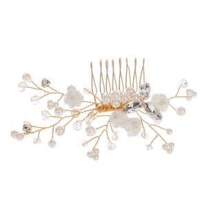 Elegant bridal hair comb with gold wire, white pearls, crystals, and floral accents