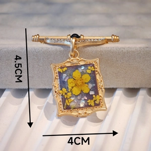 Handmade rectangle oil painting style brooch with purple resin and dried yellow flowers