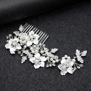 Silver bridal hair comb with alloy flowers leaves pearls and sparkling rhinestones