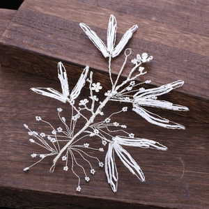 Handmade bridal hairpiece with silver wire, white tube beads and floral leaf design
