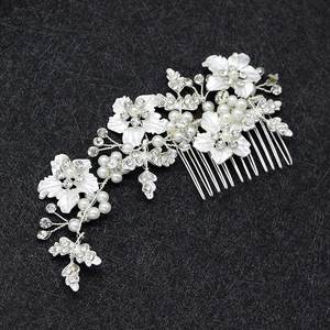Silver bridal hair comb with white flowers, sparkling rhinestones and white pearls