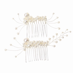 Detailed close-up of handmade bridal hair combs with elegant white pearls and silver wire