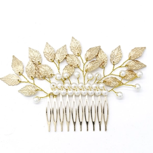 Gold Baroque leaf bridal hair comb featuring elegant white pearls on a white background