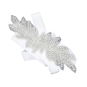 Luxurious bridal headband featuring crystal leaf appliques on white satin ribbon