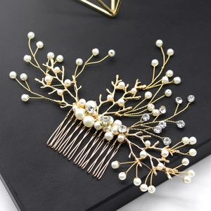 Elegant gold flower bridal hair comb with white pearls and sparkling rhinestones