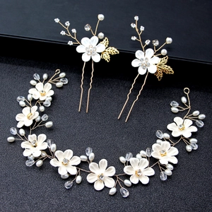 Handmade bridal hair accessories set with white flowers pearls and golden leaf vine