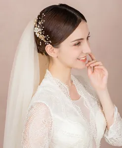 Handmade bridal hair comb with pearls and crystals on gold wire for wedding hairstyles