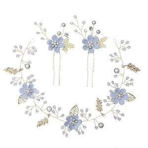 Elegant bridal hair accessories set with blue and white flowers, pearls and gold leaves