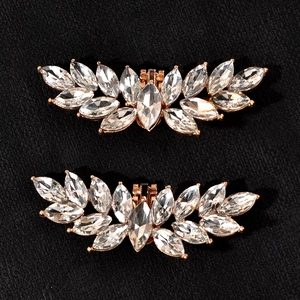 Sparkling crystal shoe clips in elegant wing shape with rose gold metal fastener