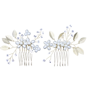 Detailed macro of handmade gold leaf and pearl bridal hair combs in a 2-piece set