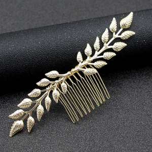 Golden olive leaf bridal hair comb with detailed veins and ten-tooth metal clip