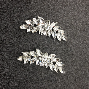 Macro view of crystal marquise shoe clips with leaf shape silver alloy base