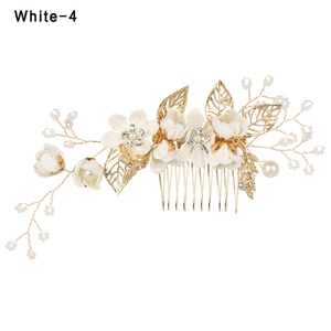 Handmade bridal hair comb with white silk flowers and pearls on golden alloy