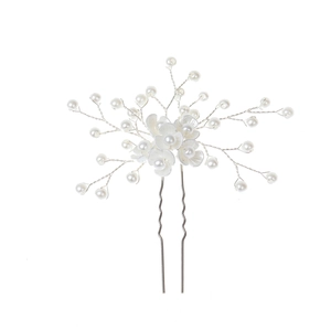 Detailed bridal hair pin with handmade pearls and white shell-style flower petals