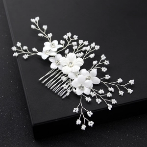 Handmade bridal hair comb with white fabric flowers and delicate pearl bead accents