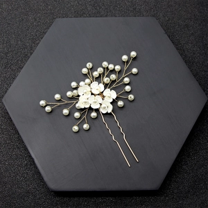 Handmade bridal hair pin with white pearl flowers and gold wire for wedding hairstyles