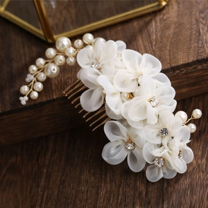 Exquisite bridal hair comb with white silk flowers, faux pearls, and sparkling crystals