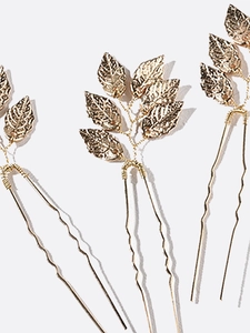 Set of three golden leaf-shaped U-shaped hair pins for elegant bridal hairstyles