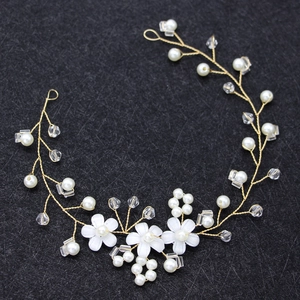 Handmade bridal headband with white pearls, crystals, and resin flowers on gold wire