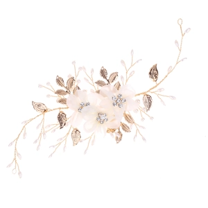 Elegant bridal headband with white fabric flowers, crystal centers and gold pearl vines