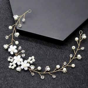 Elegant bridal headband with pearls, crystals and petals on golden wire for weddings