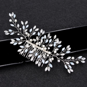 Silver bridal hair comb with pearls and crystals on a professional black jewelry box
