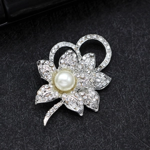 Elegant silver flower shoe clip accessory with white rhinestones and a central pearl