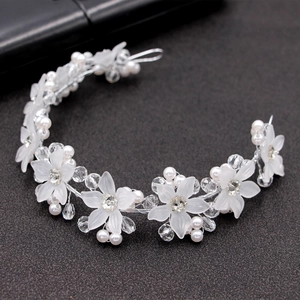 Elegant bridal floral headband with white acrylic petals, pearls and crystals on silver wire
