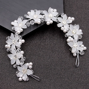 Elegant bridal headband with white frosted flowers, pearls, and crystals for weddings
