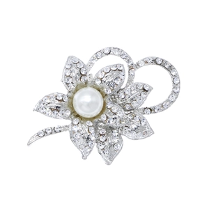 Detail of silver flower shoe clip with sparkling rhinestones and a white pearl accent