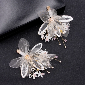 Set of two gold bridal hair clips with white mesh butterfly wings and faux pearls