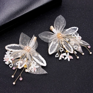Elegant pair of gold-toned mesh floral hair clips with pearls and tassel detail for brides