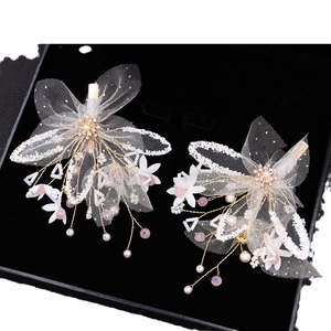 Elegant pair of gold mesh bridal hair clips with white lace flowers and pearls
