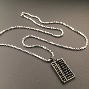Close-up of a black abacus pendant featuring movable beads on a silver box chain