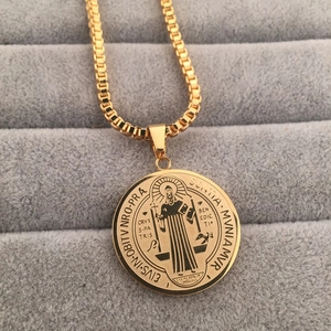 Religious St. Benedict medal pendant necklace in gold finish with box chain on velvet