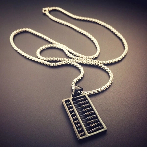 Detailed view of hip hop abacus pendant necklace featuring black and silver steel frame