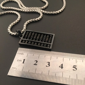 Detailed view of hip hop abacus pendant with box chain showing size measurement