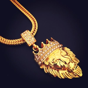 Close-up of hip hop gold lion head pendant with sparkling rhinestones and thick chain