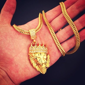 Hip hop style gold lion head pendant with crown and rhinestones on chunky franco chain