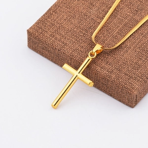 Minimalist gold plated titanium steel cylinder cross pendant with a sleek snake chain