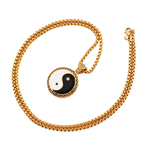 Polished gold titanium steel necklace with yin yang pendant on a box chain