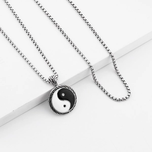 Close-up of Tai Chi Yin Yang pendant on a high-quality stainless steel Venetian chain