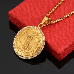 Gold dollar sign pendant necklace with rhinestones and Greek key pattern on red box