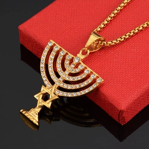 Golden Menorah and Star of David pendant necklace with crystal rhinestones on a red box