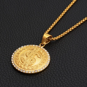 Gold dollar sign necklace with Greek key pattern and cubic zirconia on box chain