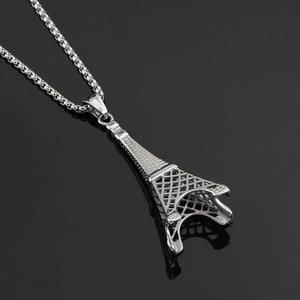 Detailed macro view of the silver Eiffel Tower pendant with hollow grid structure